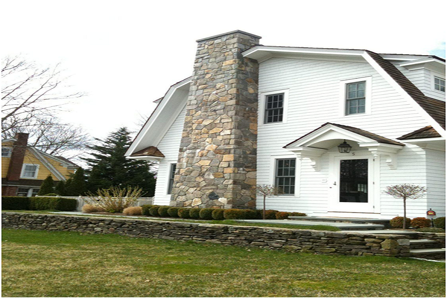 Modern chimney with stonework. 