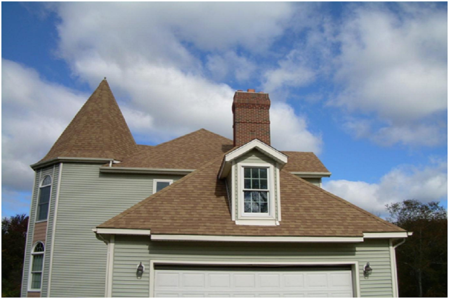 Tall, brick chimney in a house.